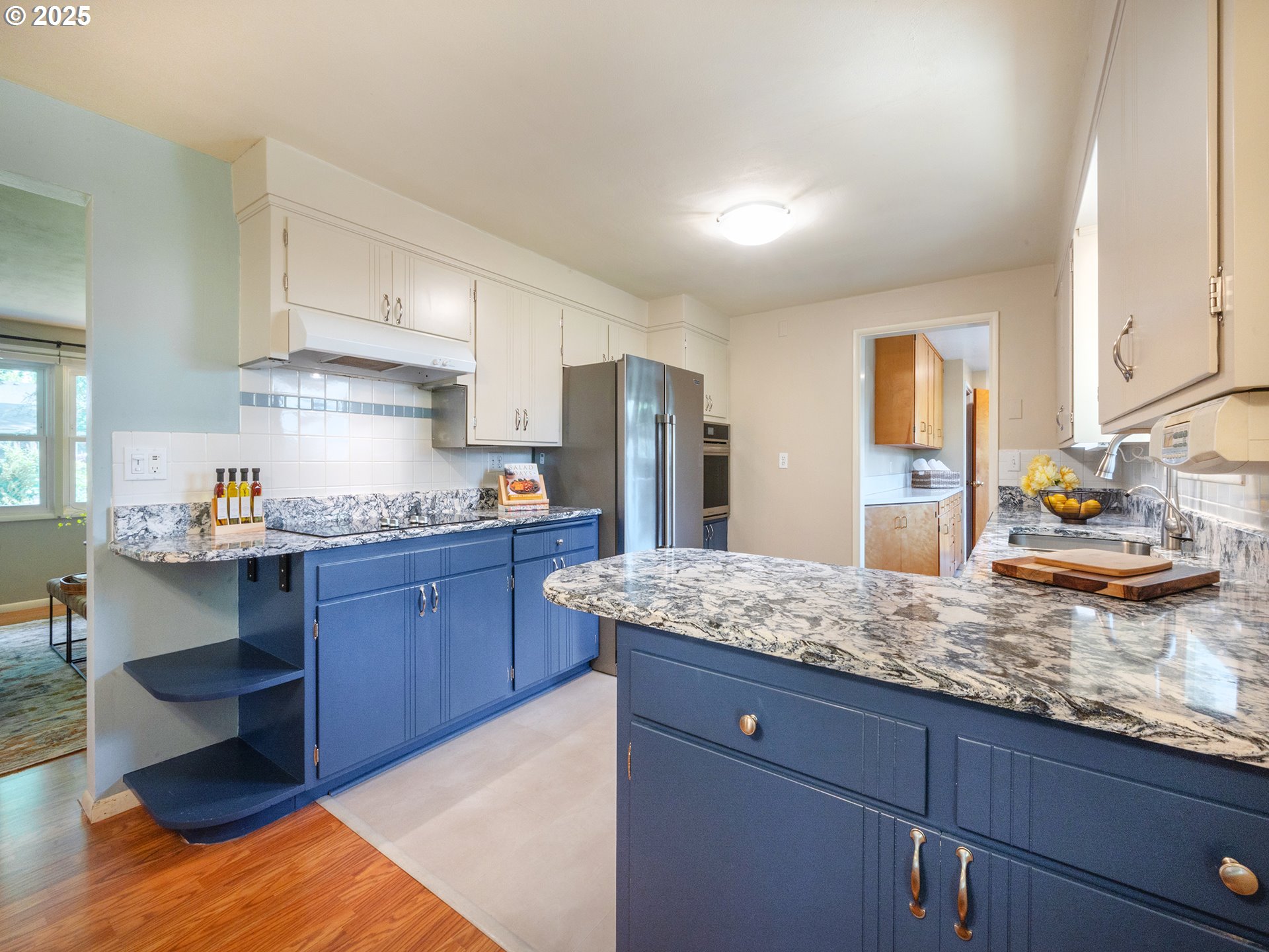 464 Spring Creek Drive Eugene, OR 97404 - Photo 7 of 45 a kitchen with granite countertop a sink and cabinets