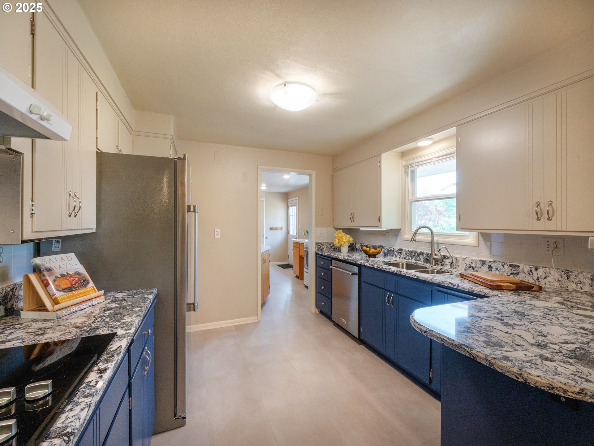 464 Spring Creek Drive Eugene, OR 97404 - Photo 8 of 45 a kitchen with granite countertop lots of counter top space and stainless steel appliances
