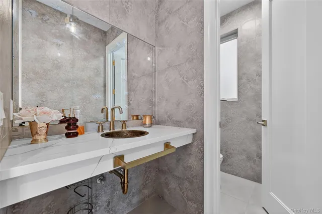 a view of a chair and tables in the balcony