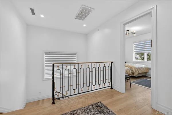 a bedroom with two beds and a window