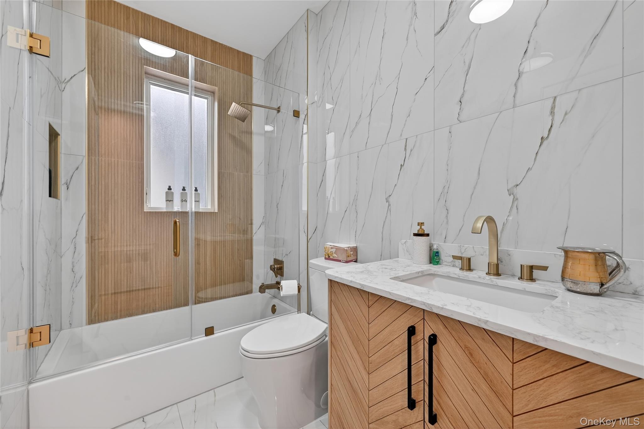 27 Ellish Parkway, Unit 202 Spring Valley, NY 10977 - Photo 41 of 50 a bathroom with a sink a toilet and shower