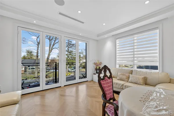 a spacious bedroom with a bed and a large window