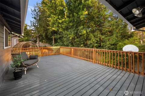 a view of a balcony with wooden floor
