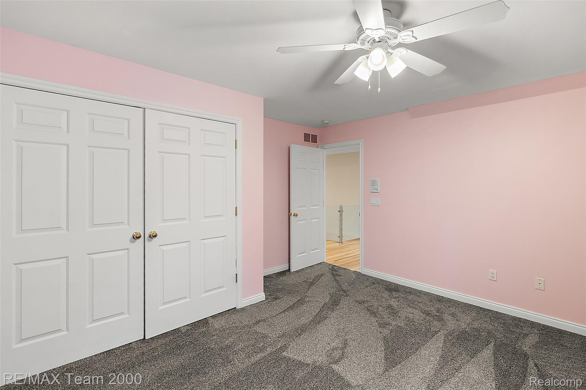 630 Sheldon Court Rochester, MI 48306 - Photo 63 of 94 Unfurnished bedroom featuring dark colored carpet, a closet, and a ceiling fan
