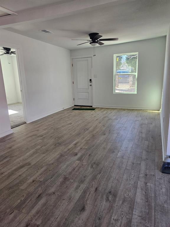 2426 South Tyler Street Dallas, TX 75224 - Photo 1 of 21 wooden floor in an empty room