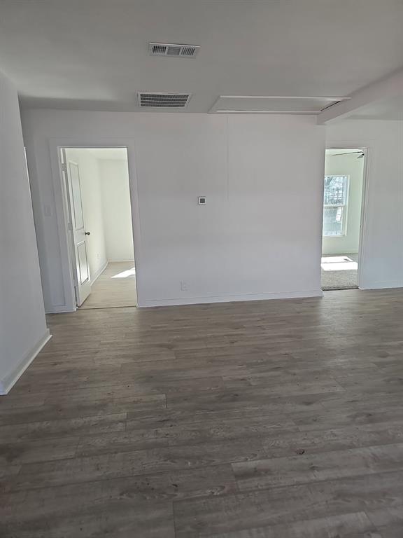 2426 South Tyler Street Dallas, TX 75224 - Photo 2 of 21 a view of an empty room with wooden floor