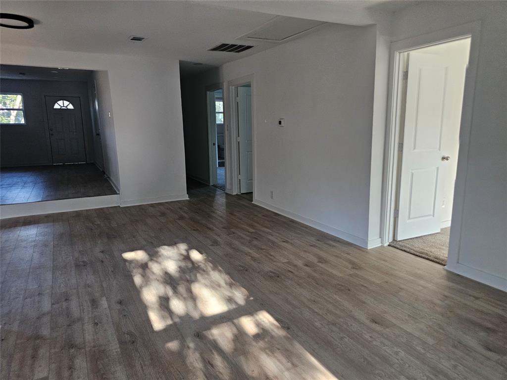 2426 South Tyler Street Dallas, TX 75224 - Photo 8 of 21 a view of a hallway with wooden floor