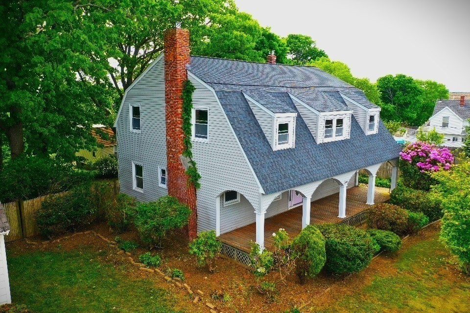 39 Squanto Road Weymouth, MA 02191 - Photo 2 of 13 a front view of house with a garden
