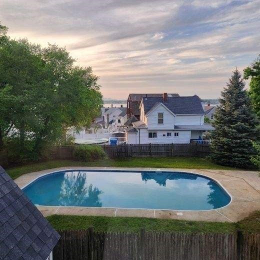 39 Squanto Road Weymouth, MA 02191 - Photo 4 of 13 a view of a swimming pool with a lake view
