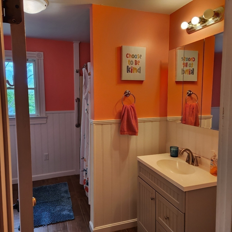 39 Squanto Road Weymouth, MA 02191 - Photo 9 of 13 a bathroom with a sink and a mirror