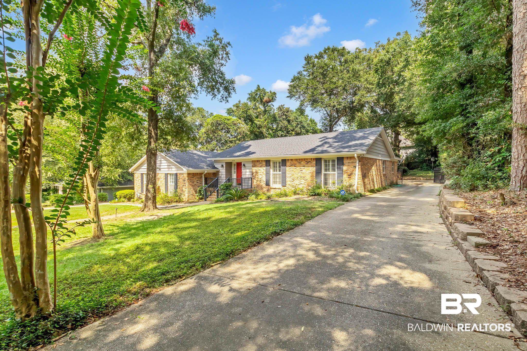 309 West Brandy Run Road Mobile, AL 36608 - Photo 3 of 100 Ranch-style home with a front lawn, driveway, a shingled roof, and brick siding