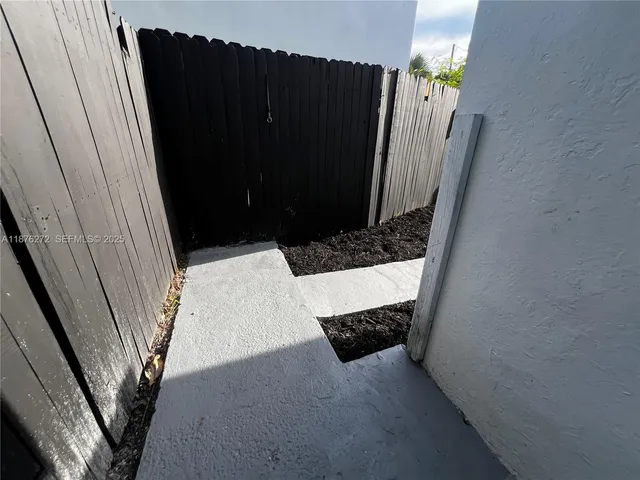 a view of a kitchen with wooden floor