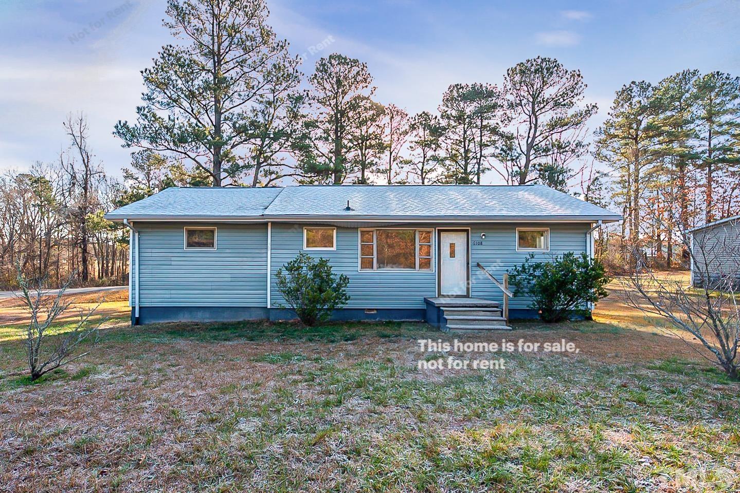 6108 Cheek Road Durham, NC 27704 - Photo 1 of 14 a view of a house with backyard and garden