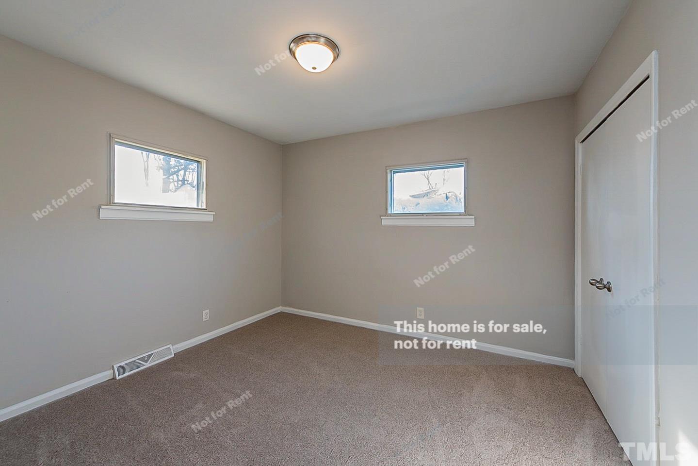 6108 Cheek Road Durham, NC 27704 - Photo 12 of 14 an empty room with a window