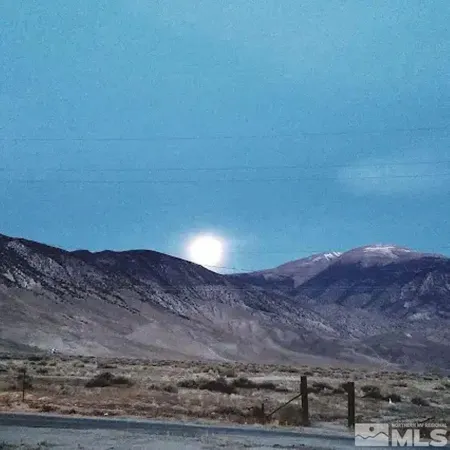 a view of mountains and valleys