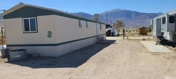 a view of a back yard of the house