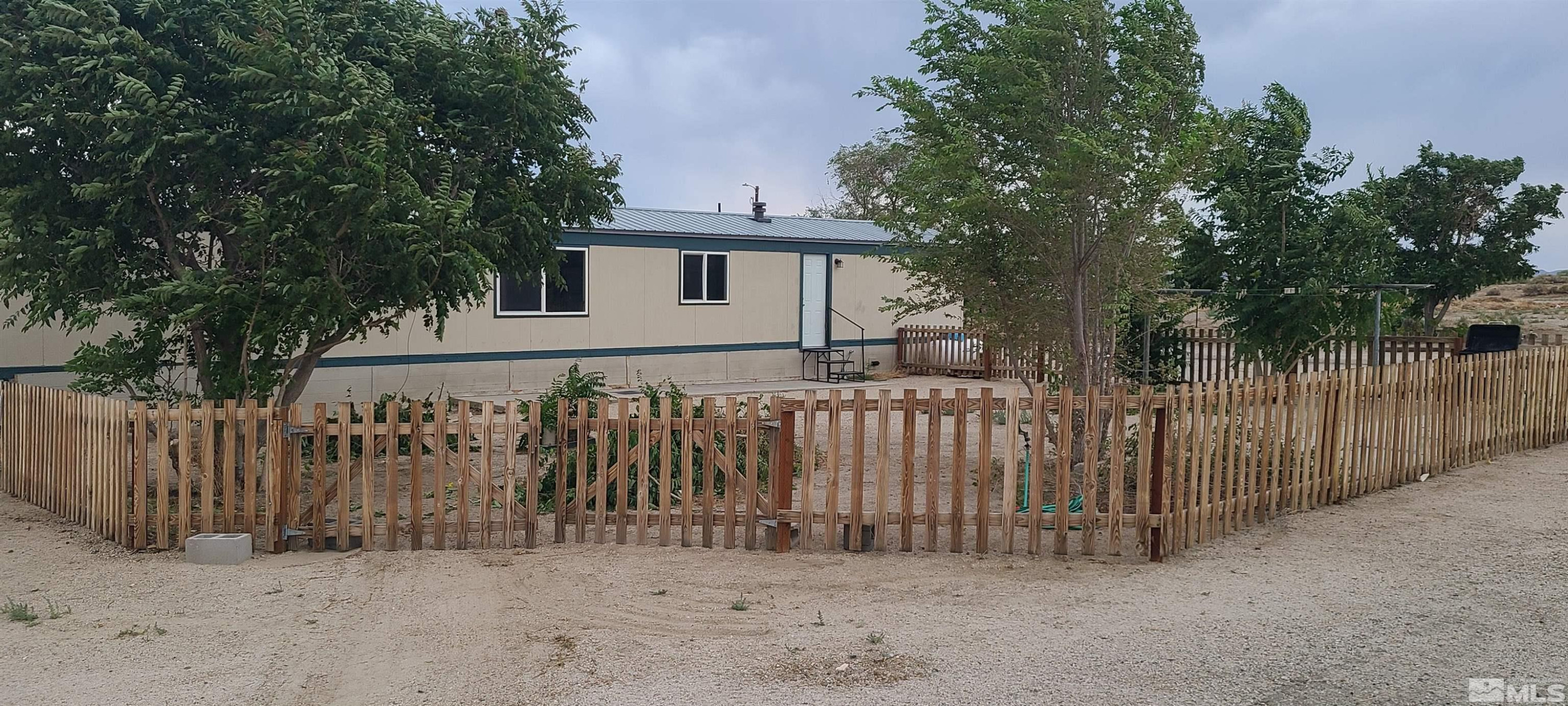 2000 Hwy 359 Hawthorne, NV 89415 - Photo 5 of 11 a white house that has tree in front of it