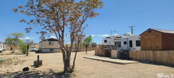 a view of a house with snow on the road