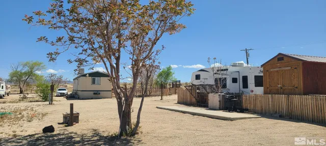 a view of a house with snow on the road