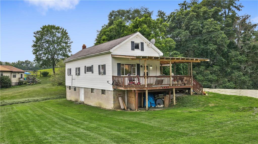 3298 Springfield Pike Normalville, PA 15469 - Photo 3 of 39 a view of a house with a yard and sitting area