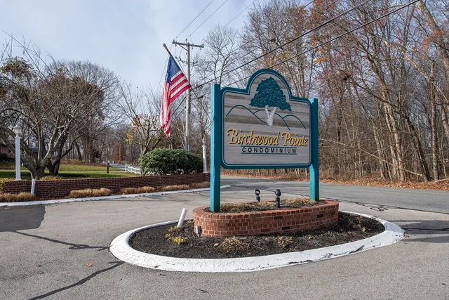 a sign that is sitting on a sidewalk