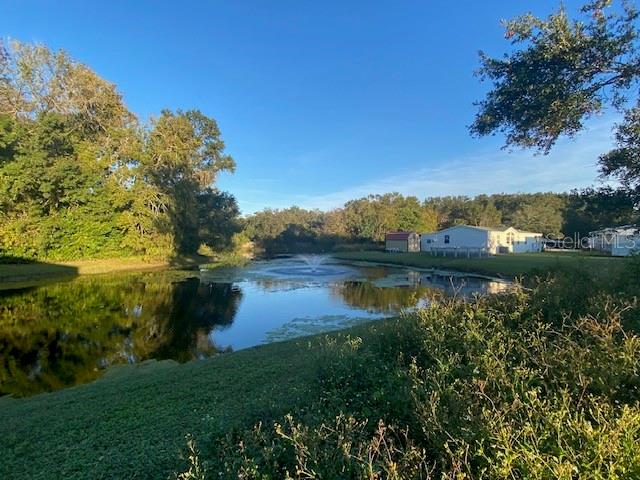 1371 Vine Street Daytona Beach, FL 32117 - Photo 2 of 9 a view of lake with green space