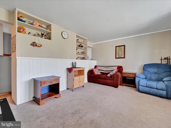 a living room with furniture and a couch