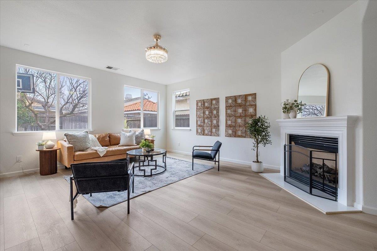 2413 Ventana View Way Modesto, CA 95355 - Photo 13 of 51 a living room with furniture and a fireplace