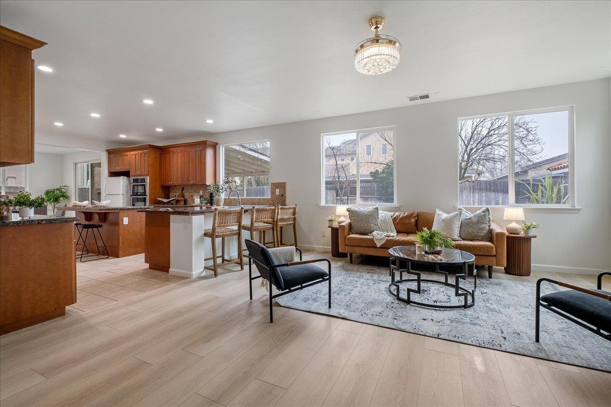 2413 Ventana View Way Modesto, CA 95355 - Photo 14 of 51 a living room with furniture and kitchen view
