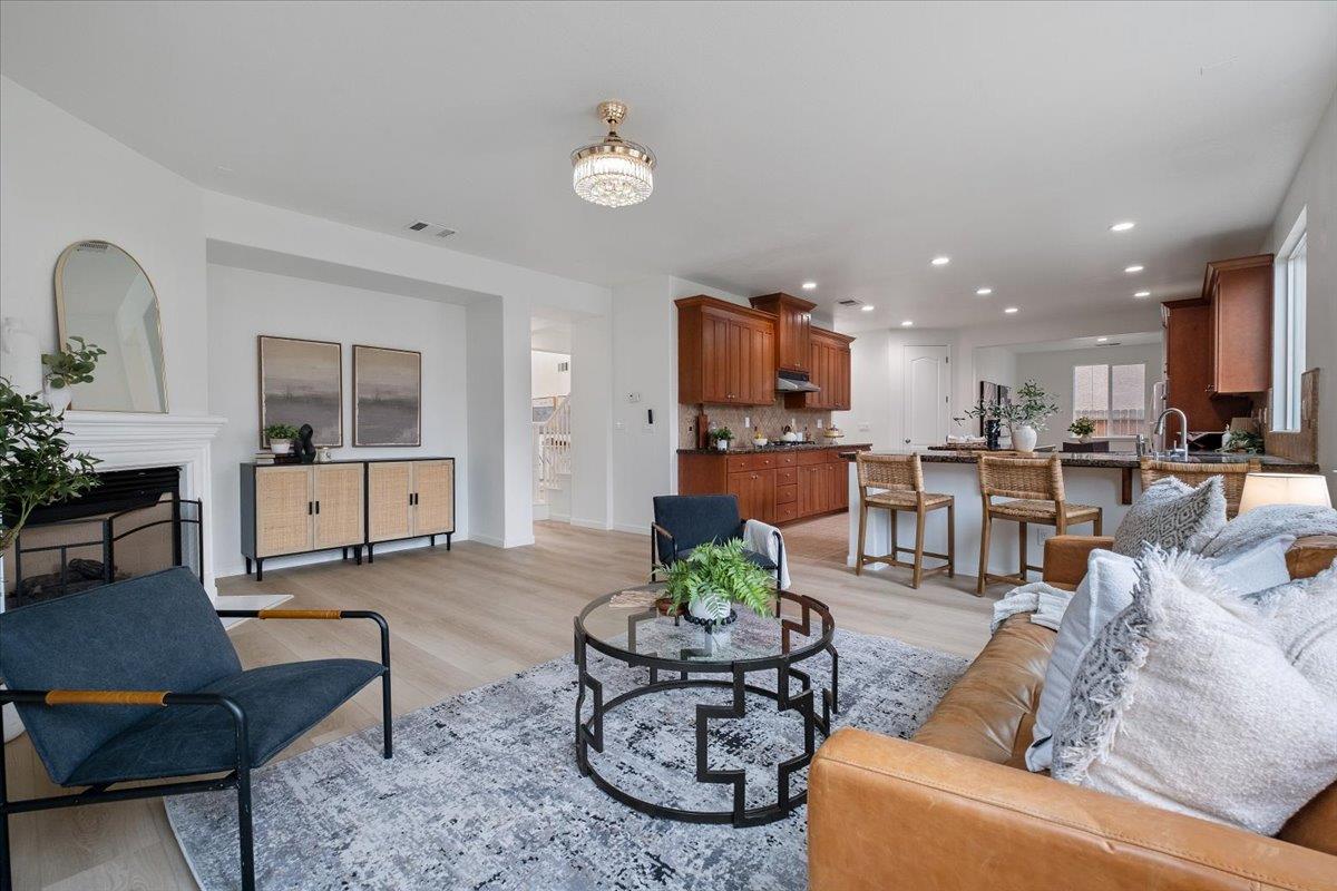 2413 Ventana View Way Modesto, CA 95355 - Photo 15 of 51 a living room with furniture and kitchen view