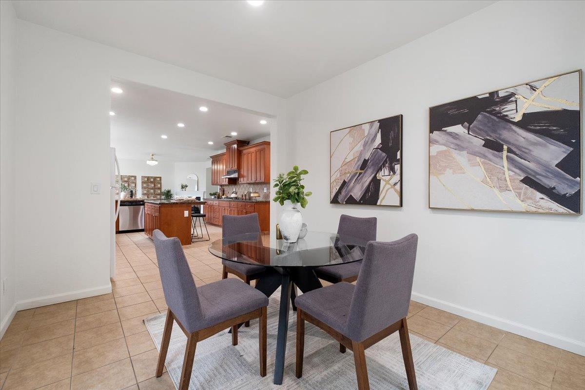 2413 Ventana View Way Modesto, CA 95355 - Photo 21 of 51 a view of a dining room with furniture and wooden floor