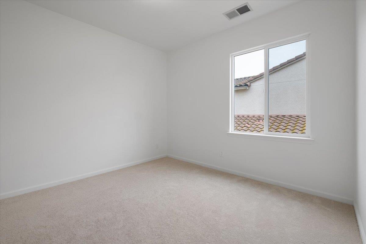 2413 Ventana View Way Modesto, CA 95355 - Photo 37 of 51 an empty room with a window