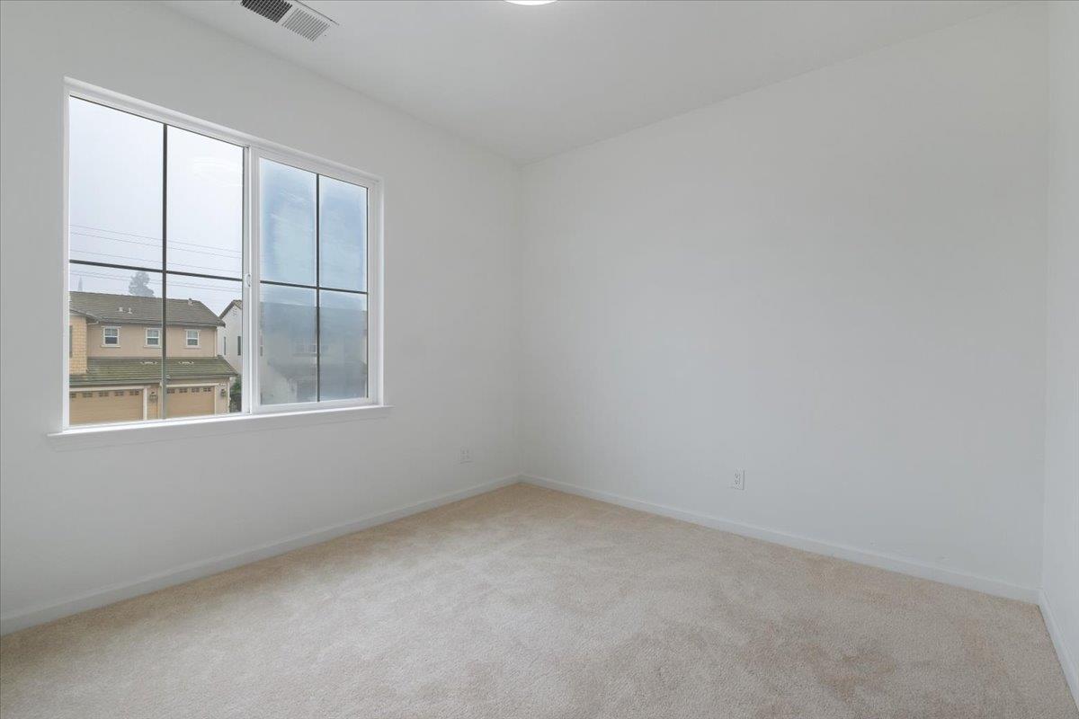 2413 Ventana View Way Modesto, CA 95355 - Photo 40 of 51 an empty room with windows