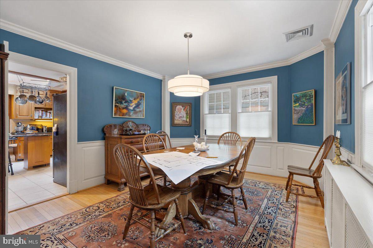 130 Hilltop Road Silver Spring, MD 20910 - Photo 11 of 48 a view of a dining room with furniture window and wooden floor