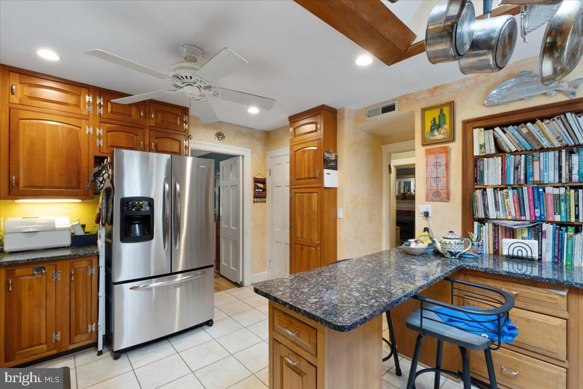 130 Hilltop Road Silver Spring, MD 20910 - Photo 15 of 48 a kitchen with stainless steel appliances granite countertop a refrigerator a stove and a sink
