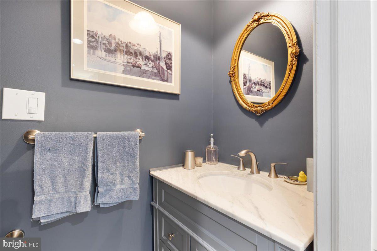 130 Hilltop Road Silver Spring, MD 20910 - Photo 17 of 48 a bathroom with a sink and a mirror