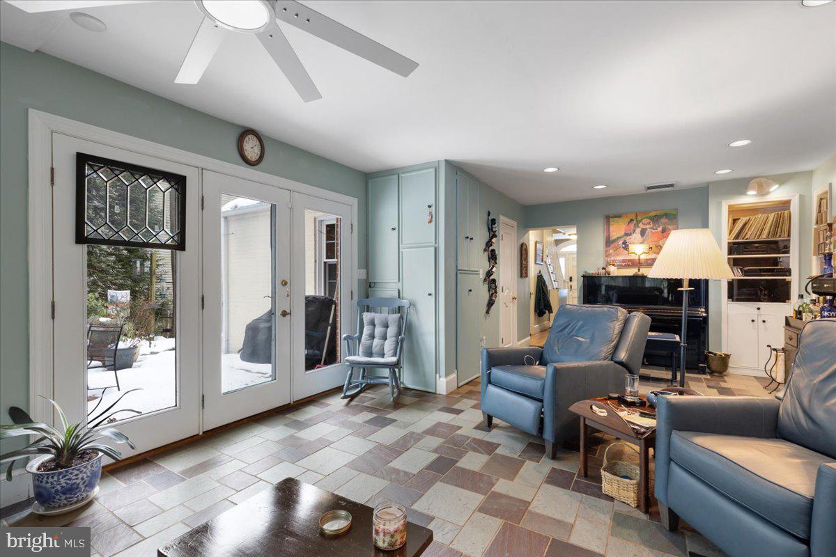 130 Hilltop Road Silver Spring, MD 20910 - Photo 20 of 48 a living room with furniture and large windows