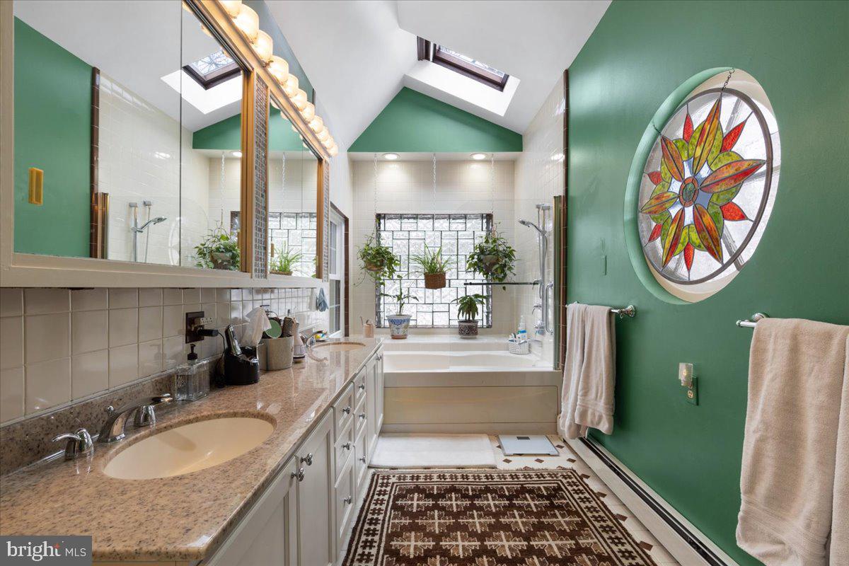 130 Hilltop Road Silver Spring, MD 20910 - Photo 28 of 48 a bathroom with a granite countertop sink and a mirror