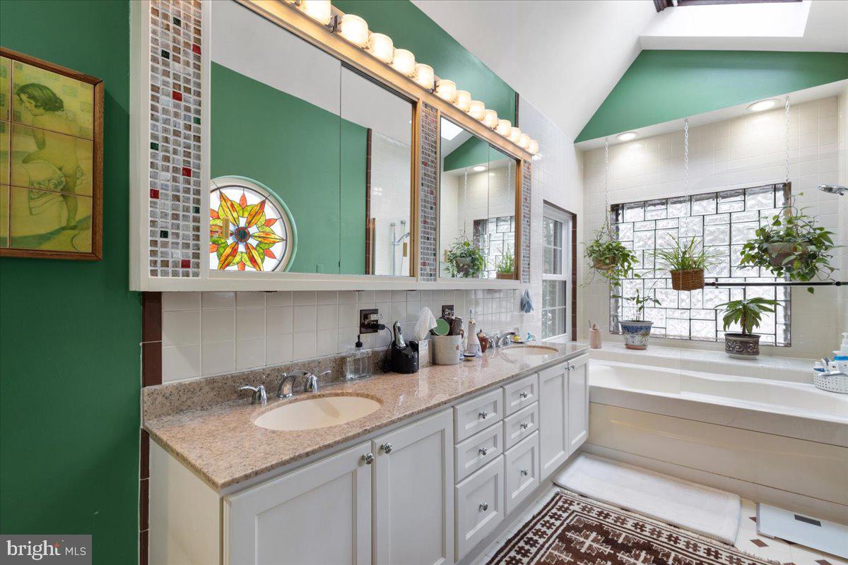 130 Hilltop Road Silver Spring, MD 20910 - Photo 29 of 48 a bathroom with a sink and a mirror