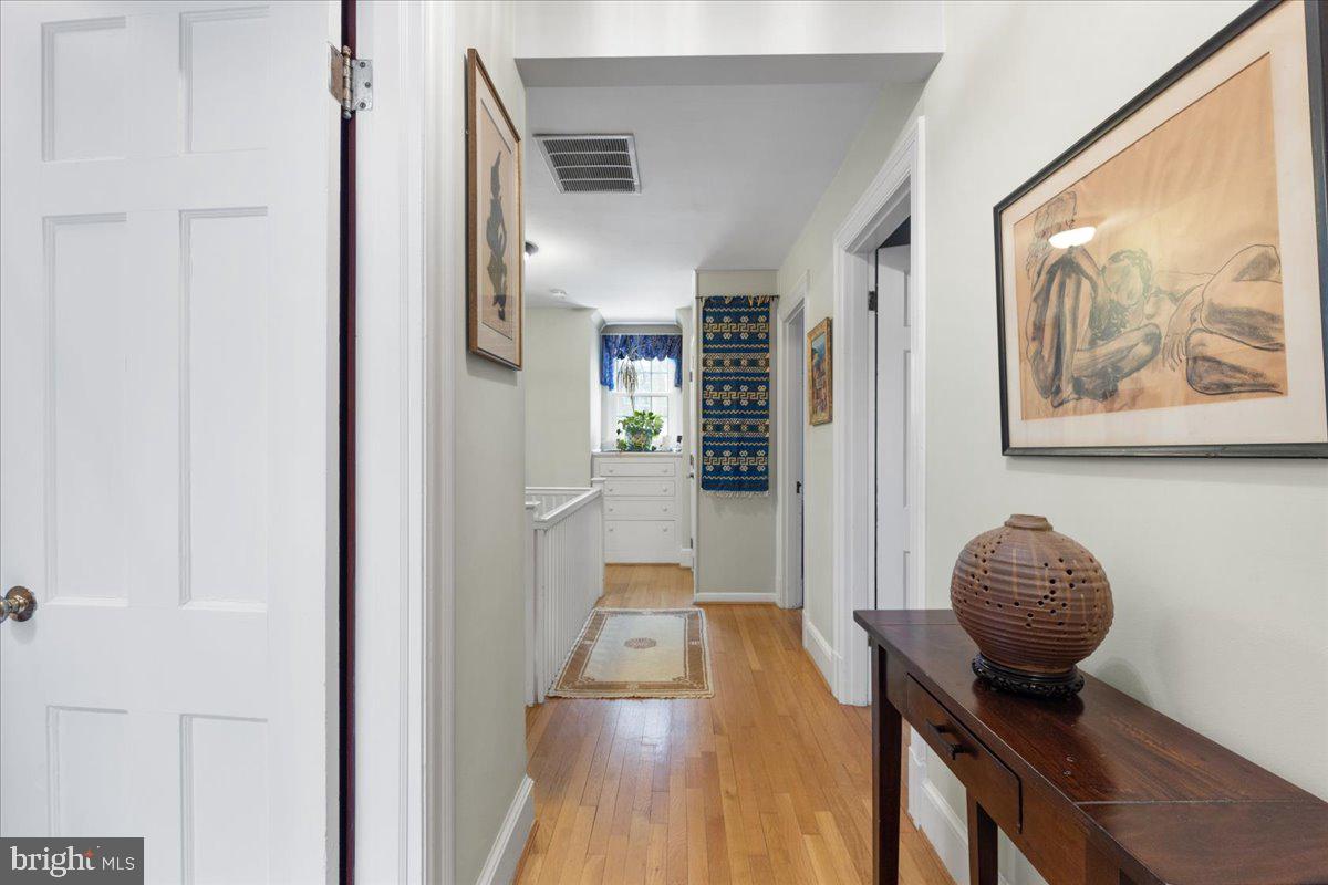 130 Hilltop Road Silver Spring, MD 20910 - Photo 30 of 48 a view of a hallway with furniture and wooden floor