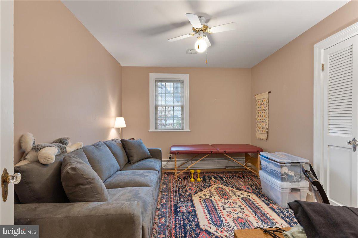 130 Hilltop Road Silver Spring, MD 20910 - Photo 31 of 48 a living room with a couch and a window
