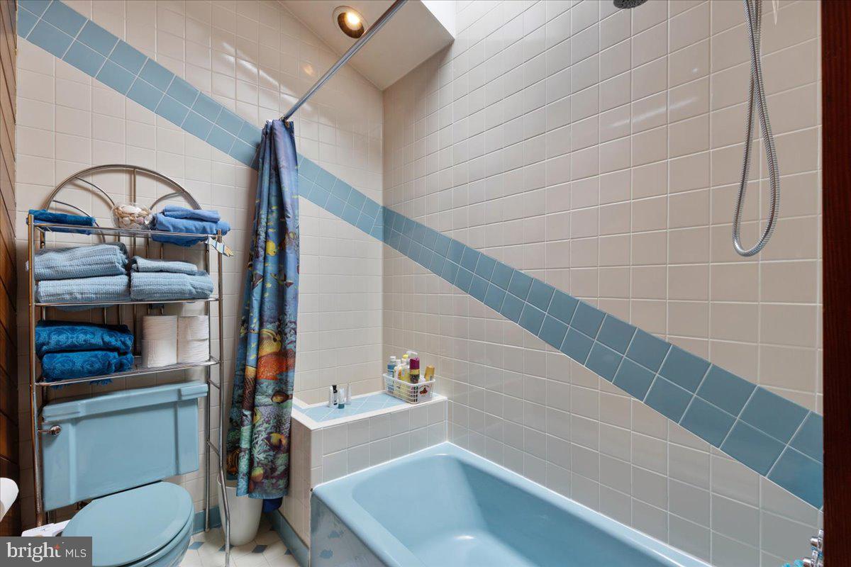 130 Hilltop Road Silver Spring, MD 20910 - Photo 33 of 48 a bathroom with a sink a toilet and shower