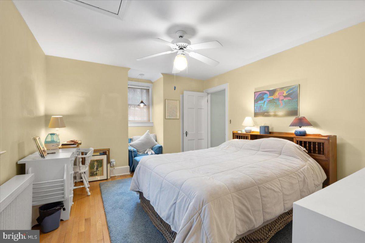 130 Hilltop Road Silver Spring, MD 20910 - Photo 38 of 48 a bed room with a bed and a chandelier