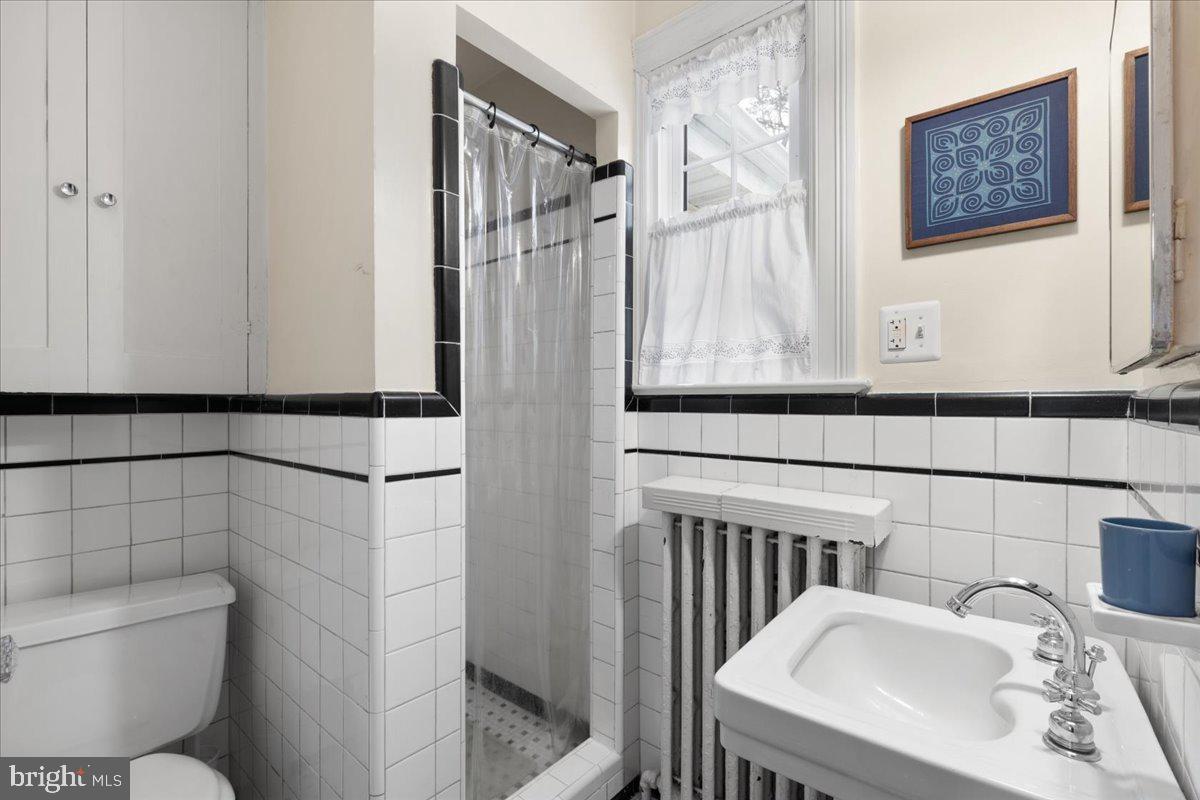 130 Hilltop Road Silver Spring, MD 20910 - Photo 39 of 48 a bathroom with a sink and toilet