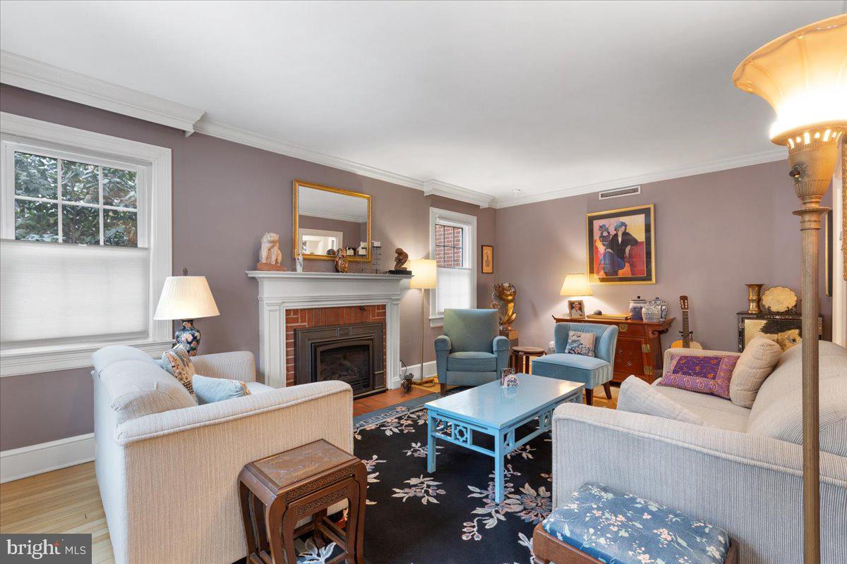 130 Hilltop Road Silver Spring, MD 20910 - Photo 5 of 48 a living room with furniture and a fireplace
