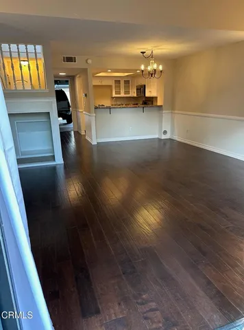 a view of a living room and a kitchen