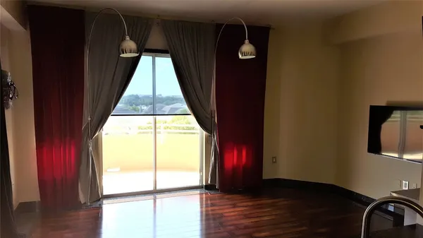 a balcony with wooden floor