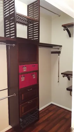 a bathroom with a granite countertop sink a toilet and a shower