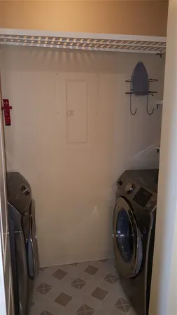a view of a storage & utility room with a sink