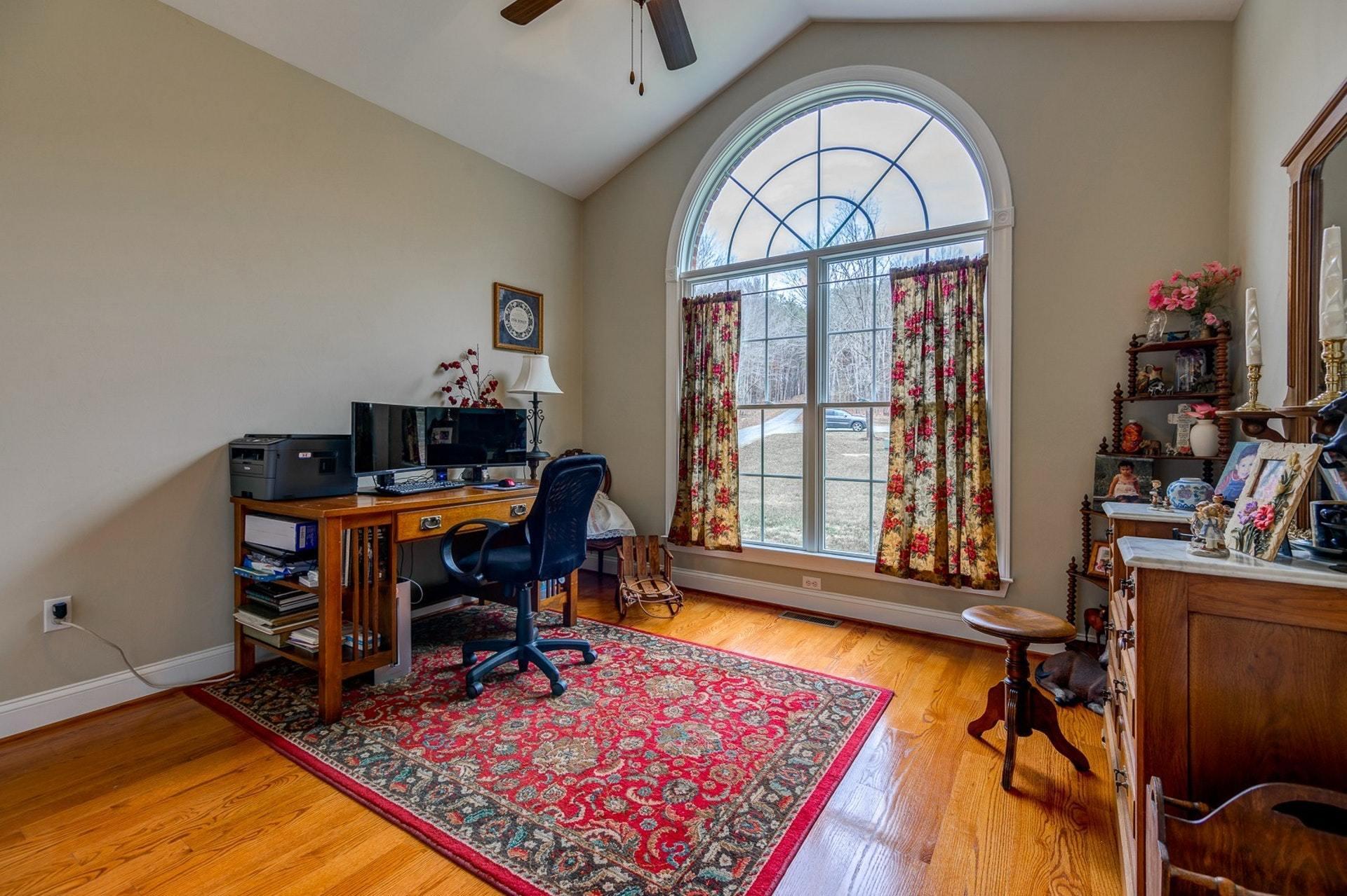 565 Charlie Road Hardy, VA 24101 - Photo 11 of 58 a view of a workspace with furniture and a window